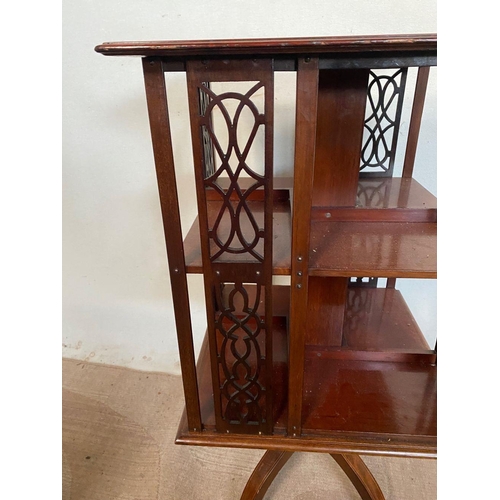 12 - A DECORATIVE MAHGOANY INLAID REVOLVING BOOKCASE, with shell inlay to top, as well as fretwork suppor... 