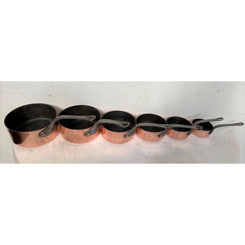 126 - A SET OF SIX COPPER SAUCEPANS, complete with steel handles