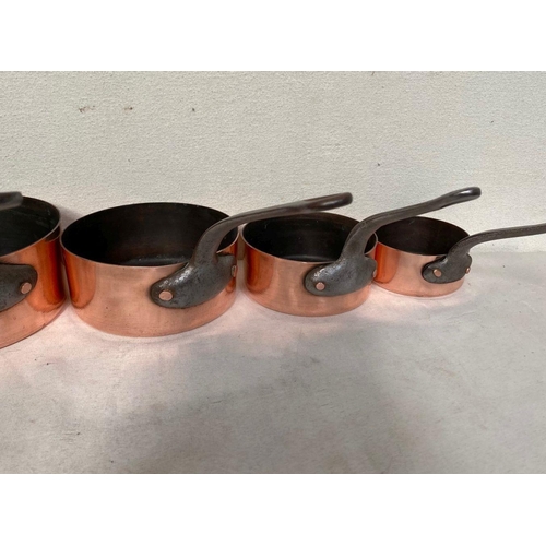 126 - A SET OF SIX COPPER SAUCEPANS, complete with steel handles