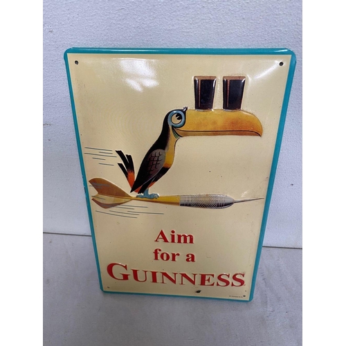 131 - A VINTAGE GUINNESS ADVERTISING SIGN, with toucan, reading ‘Aim for a Guinness’, in good condition.