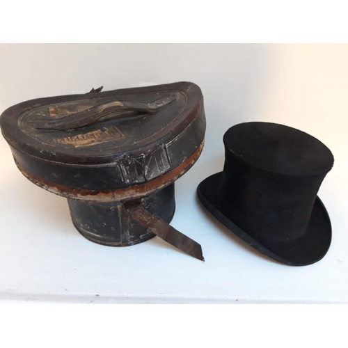 143 - A LATE 19TH CENTURY IRISH LEATHER TOP HAT BOX COMPLETE WITH TOP HAT, by Cork maker, label reading ‘H... 
