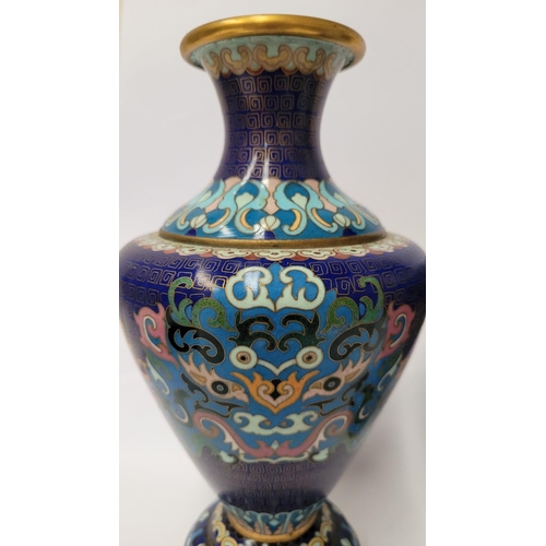 20 - A PAIR OF ANTIQUE CLOISANNE VASES, baluster form, with vibrant multicolour design on deep blue groun... 