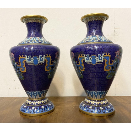 20 - A PAIR OF ANTIQUE CLOISANNE VASES, baluster form, with vibrant multicolour design on deep blue groun... 