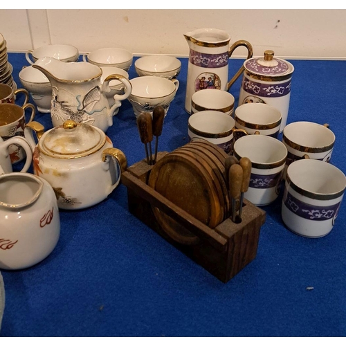 221 - A MIXED LOT OF ORIENTAL-STYLE TEA SERVICE  PIECES to include coasters, sugar prongs, tea cups, milk ... 