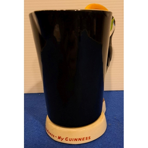 232 - A FINE CERAMIC GUINESS BRANDED TANKARD produced in England; 18cm high.