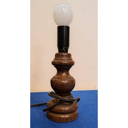 237 - AN UNUSUAL CARVED BANANA-STYLE LAMP along with smaller ring turned lamp; tallest piece 33cm.