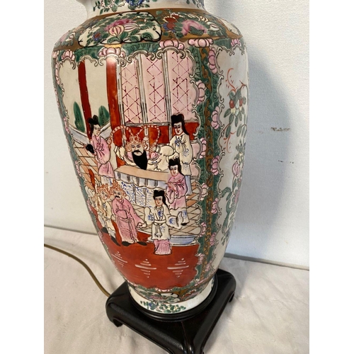 26 - A CHINESE FAMILLE ROSE URN TABLE LAMP, decorated with painted figural panels surrounded by floral de... 