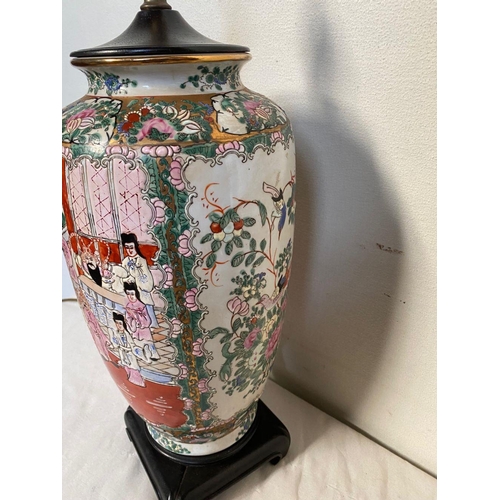 26 - A CHINESE FAMILLE ROSE URN TABLE LAMP, decorated with painted figural panels surrounded by floral de... 