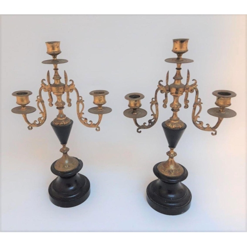 28 - A PAIR OF VICTORIAN GILT BRASS THREE BRANCH CANDLEABRA, c.1890, ornate design to candle stems, urn s... 