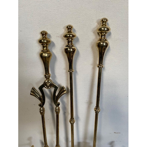 39 - AN EXCELLENT SET OF POLISHED BRASS FIRE IRONS & DOGS, to include tongs, poker, shovel and dogs, all ... 