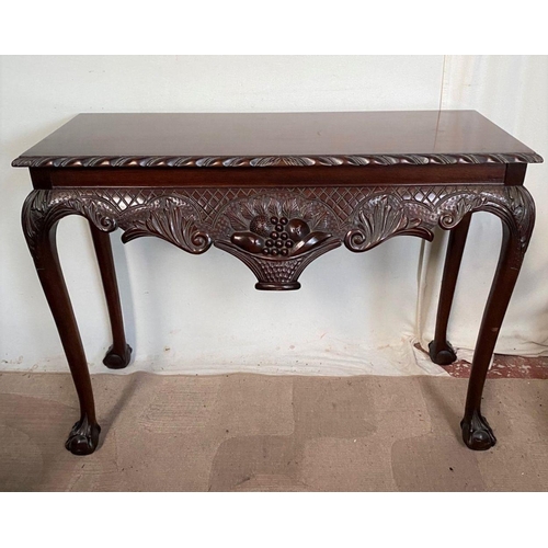 44 - AN IRISH STYLE MAHOGANY HALL TABLE, with carving to edge above decorative carved frieze with fruit b... 