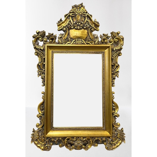 48 - A DECORATIVE VINTAGE OVERMANTLE MIRROR, rectangular form bevelled glass within ornate gilt carved fr... 
