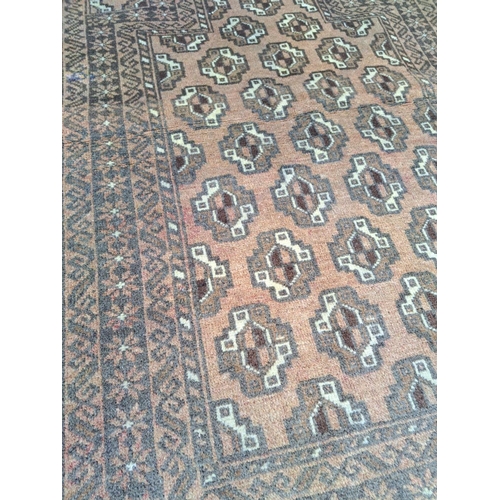 55 - AN ANTIQUE BELOUCH FLOOR RUG / PRAYER RUG, hand-knotted with tradition colour & design. 130 x 80cm.