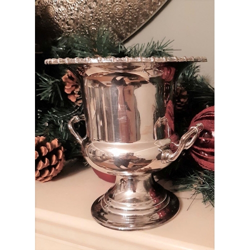 56 - A VINTAGE DECORATIVE CHAMPAGNE SILVER PLATED ICE BUCKET, urn shaped with decorative rim, two handles... 