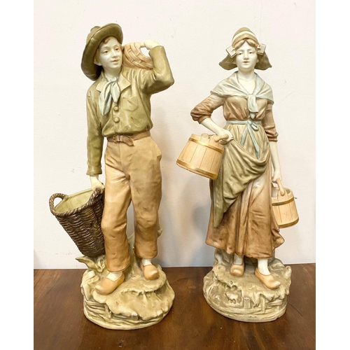 59 - A PAIR OF VINTAGE ROYAL DUX PORCELAIN FIGURES, IN THE FORM OF MALE AND FEMALE WATER CARRIERS, both n... 
