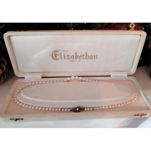 61 - A VINTAGE ELIZABETHAN PEARL NECKLACE, c.1950, with decorative sterling silver clasp, in original box... 