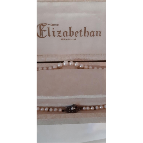 61 - A VINTAGE ELIZABETHAN PEARL NECKLACE, c.1950, with decorative sterling silver clasp, in original box... 