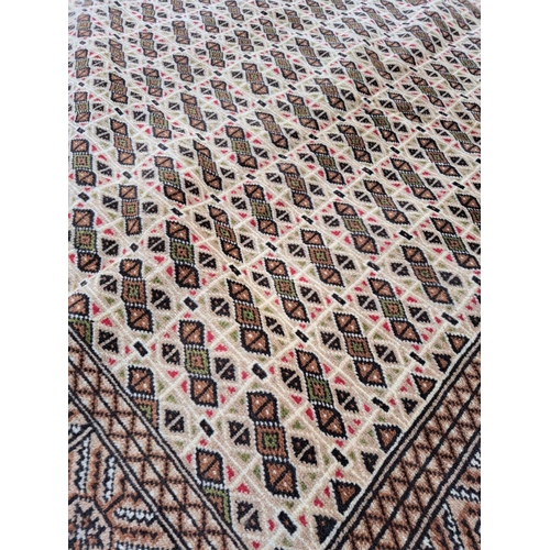 63 - A VERY GOOD QUALITY PAKISTANI MADE PERSIAN DESIGIN FLOOR RUG, with a repeat pattern all over; overal... 