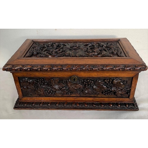 64 - AN EXCELLENT QUALITY CARVED OAK JEWELLERY BOX, with carved grapevine panels to top and sides, with s... 