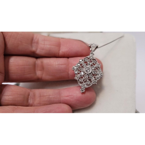 73 - A FANTASTIC 14CT WHITE GOLD FILIGREE WORKED DIAMOND SET PENDANT ON CHAIN, this piece is really speci... 