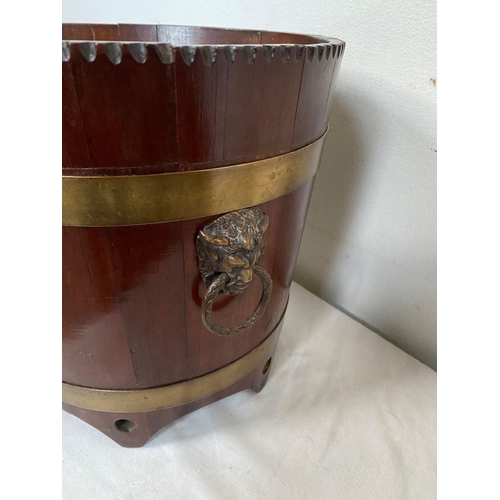 96 - AN IRISH MAHOGANY BRASS BOUND JARDINIERE, carving to top, with two brass bindings, as well as two li... 