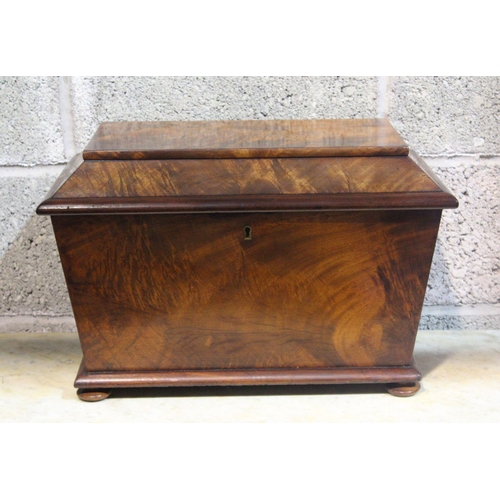 101 - A LARGE 19TH CENTURY MAHOGANY TEA-CADDY, decorated with a flamed mahogany grain; lid with brass escu... 