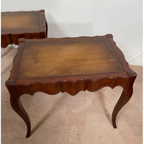 104 - A PAIR OF MAHOGANY SHAPED LEATHER TOPPED COFFEE TABLES, shaped top with leather inset, both standing... 