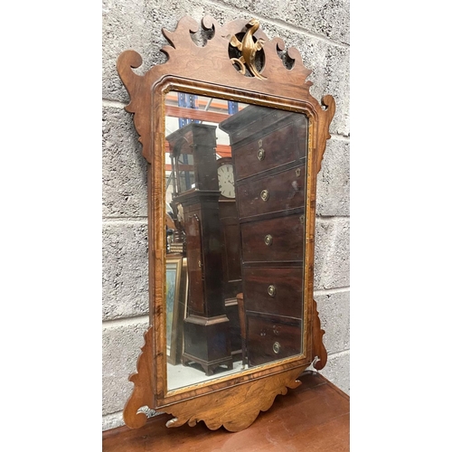 106 - A DECORATIVE MAHOGANY & GILTWOOD WALL MIRROR, of rectangular form, with bevelled glass surrounded by... 