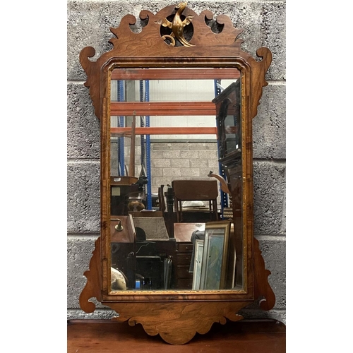 106 - A DECORATIVE MAHOGANY & GILTWOOD WALL MIRROR, of rectangular form, with bevelled glass surrounded by... 