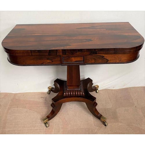 11 - A RECENCY ROSEWOOD CARD TABLE, opening to green baize lined interior, above beaded carving to frieze... 