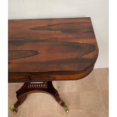 11 - A RECENCY ROSEWOOD CARD TABLE, opening to green baize lined interior, above beaded carving to frieze... 