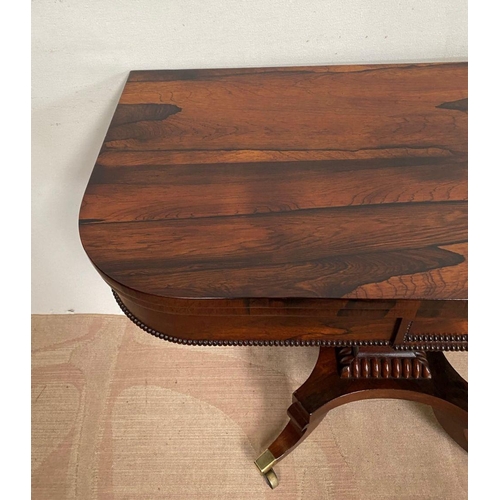 11 - A RECENCY ROSEWOOD CARD TABLE, opening to green baize lined interior, above beaded carving to frieze... 