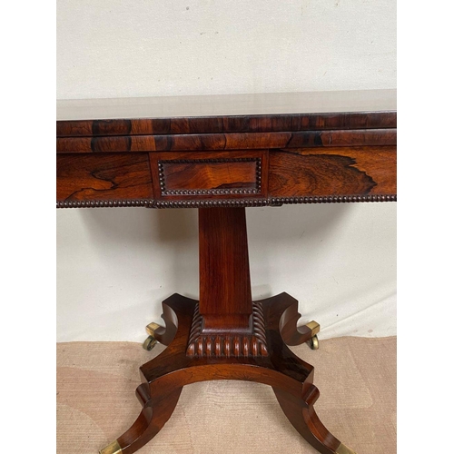 11 - A RECENCY ROSEWOOD CARD TABLE, opening to green baize lined interior, above beaded carving to frieze... 