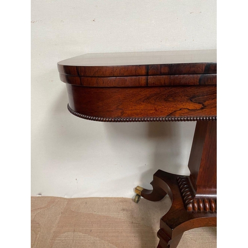 11 - A RECENCY ROSEWOOD CARD TABLE, opening to green baize lined interior, above beaded carving to frieze... 