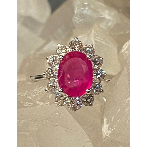 120 - A STRIKING 18CT WHITE GOLD BURMESE RUBY AND DIAMOND CLUSTER RING, diamonds in claw setting, Ruby wei... 