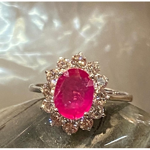 120 - A STRIKING 18CT WHITE GOLD BURMESE RUBY AND DIAMOND CLUSTER RING, diamonds in claw setting, Ruby wei... 