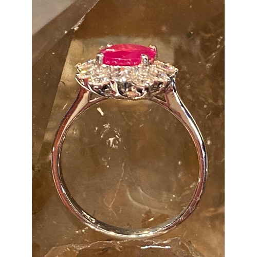 120 - A STRIKING 18CT WHITE GOLD BURMESE RUBY AND DIAMOND CLUSTER RING, diamonds in claw setting, Ruby wei... 