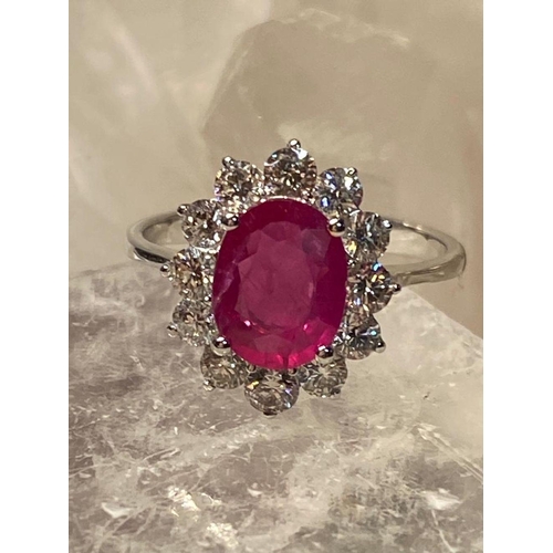 120 - A STRIKING 18CT WHITE GOLD BURMESE RUBY AND DIAMOND CLUSTER RING, diamonds in claw setting, Ruby wei... 