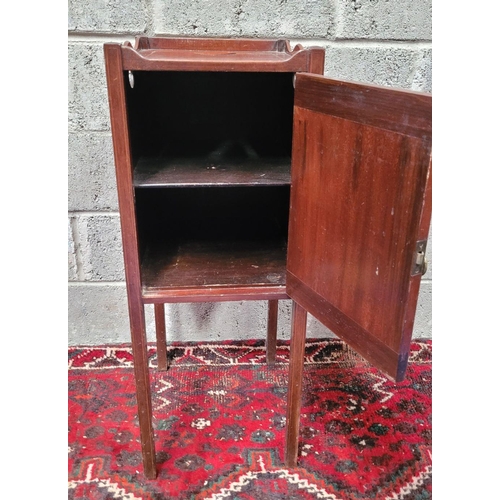 131 - A LATE 19th / EARLY 20TH CENTURY MAHOGANY STRING INLAID CABINET, with brass pull-ring handle to the ... 