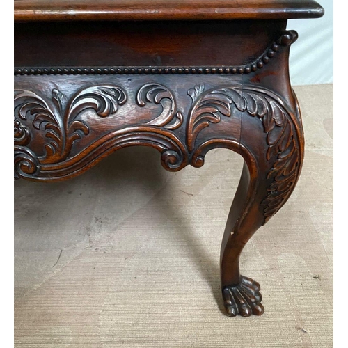 134 - A GOOD QUALITY IRISH STYLE MAHOGANY COFFEE TABLE, with beading above shaped and carved frieze, stand... 