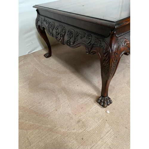 134 - A GOOD QUALITY IRISH STYLE MAHOGANY COFFEE TABLE, with beading above shaped and carved frieze, stand... 