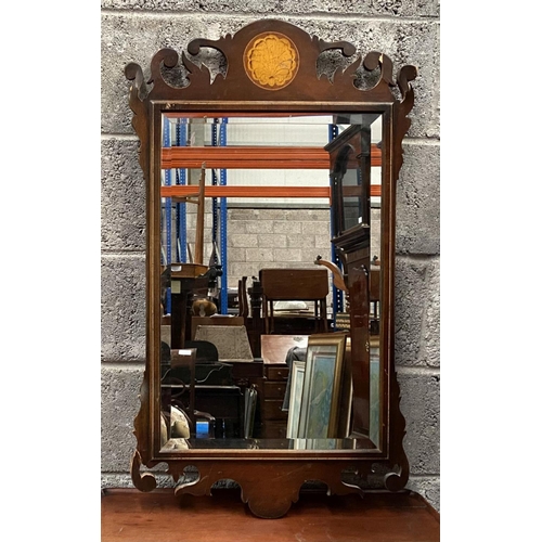 135 - A DECORATIVE MAHOGANY INLAID WALL MIRROR, of rectangular form, with bevelled glass surrounded by mol... 