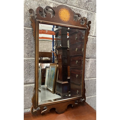 135 - A DECORATIVE MAHOGANY INLAID WALL MIRROR, of rectangular form, with bevelled glass surrounded by mol... 