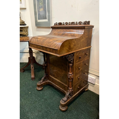 14 - A GOOD QUALITY 19TH CENTURY BURR WALNUT DAVENPORT WRITING DESK, with galleried top above shaped fron... 