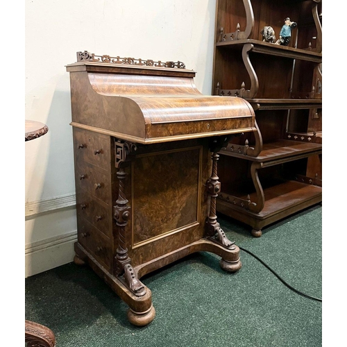 14 - A GOOD QUALITY 19TH CENTURY BURR WALNUT DAVENPORT WRITING DESK, with galleried top above shaped fron... 