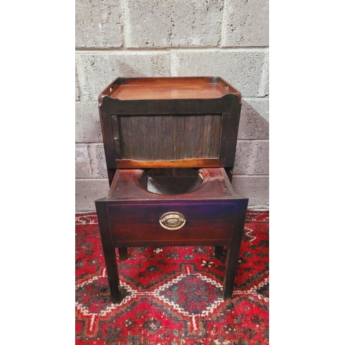 140 - A GEORGIAN TAMBOUR FRONTED WASH CABINET, the top with raised sides having a pierced handle on the le... 