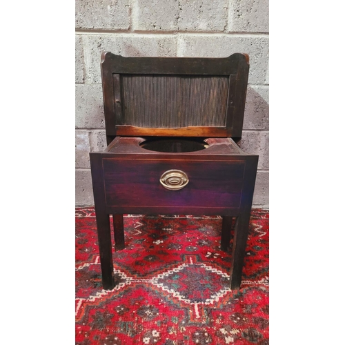 140 - A GEORGIAN TAMBOUR FRONTED WASH CABINET, the top with raised sides having a pierced handle on the le... 