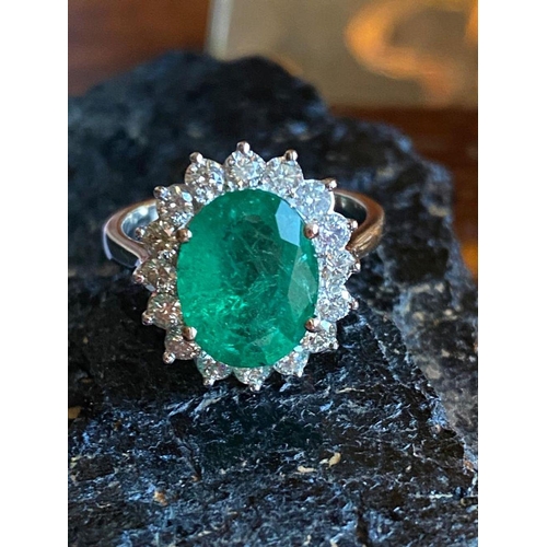 15 - AN EXQUISITE 18CT WHITE GOLD COLUMBIAN EMERALD & DIAMOND CLUSTER RING, natural oval Columbian emeral... 