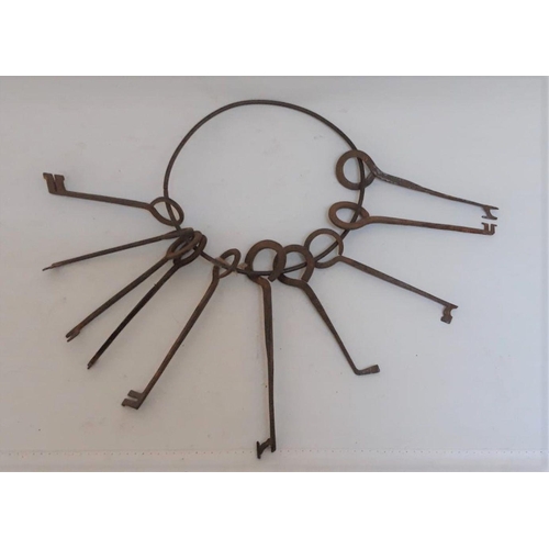 155 - A SET OF TEN LARGE EARLY 19TH CENTURY ‘SKELETON’/LOCKSMITHS KEYS, dimensions: largest: 21cm long app... 