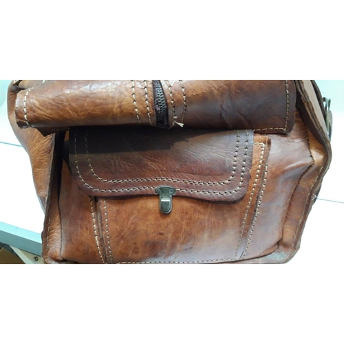 157 - A VINTAGE FRENCH BROWN LEATHER TRAVEL BAG, with multiple storage compartments. Dimensions: 60cm long... 